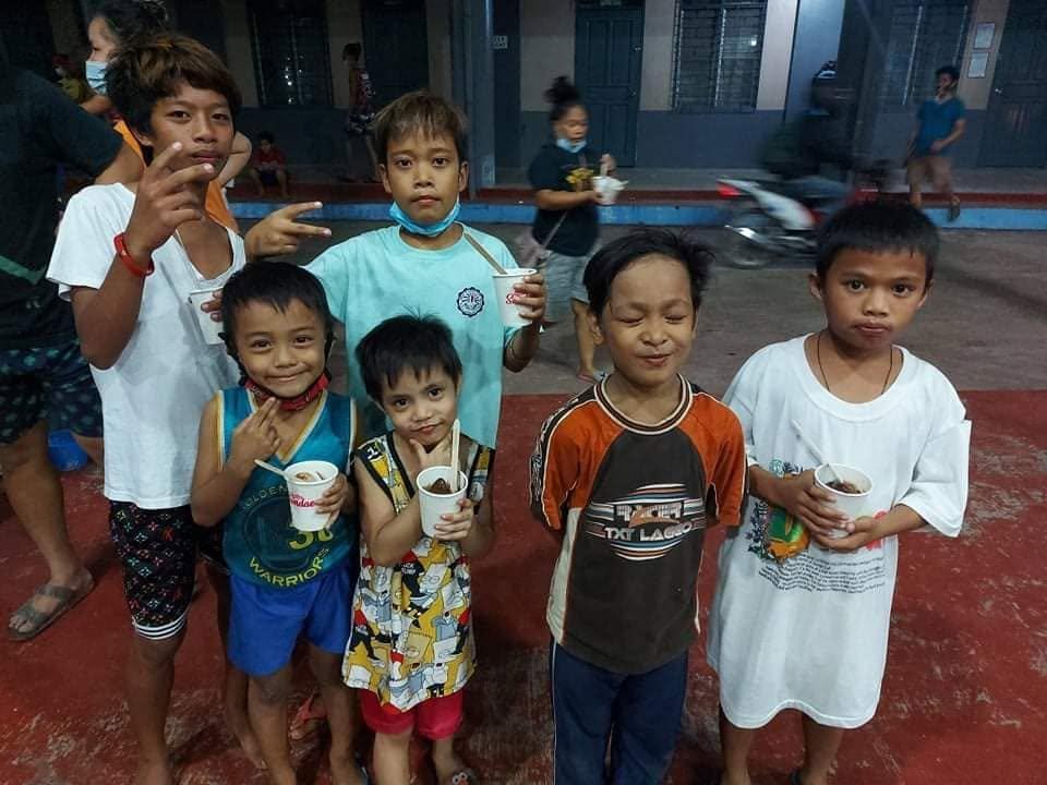 Children holding ice cream cups