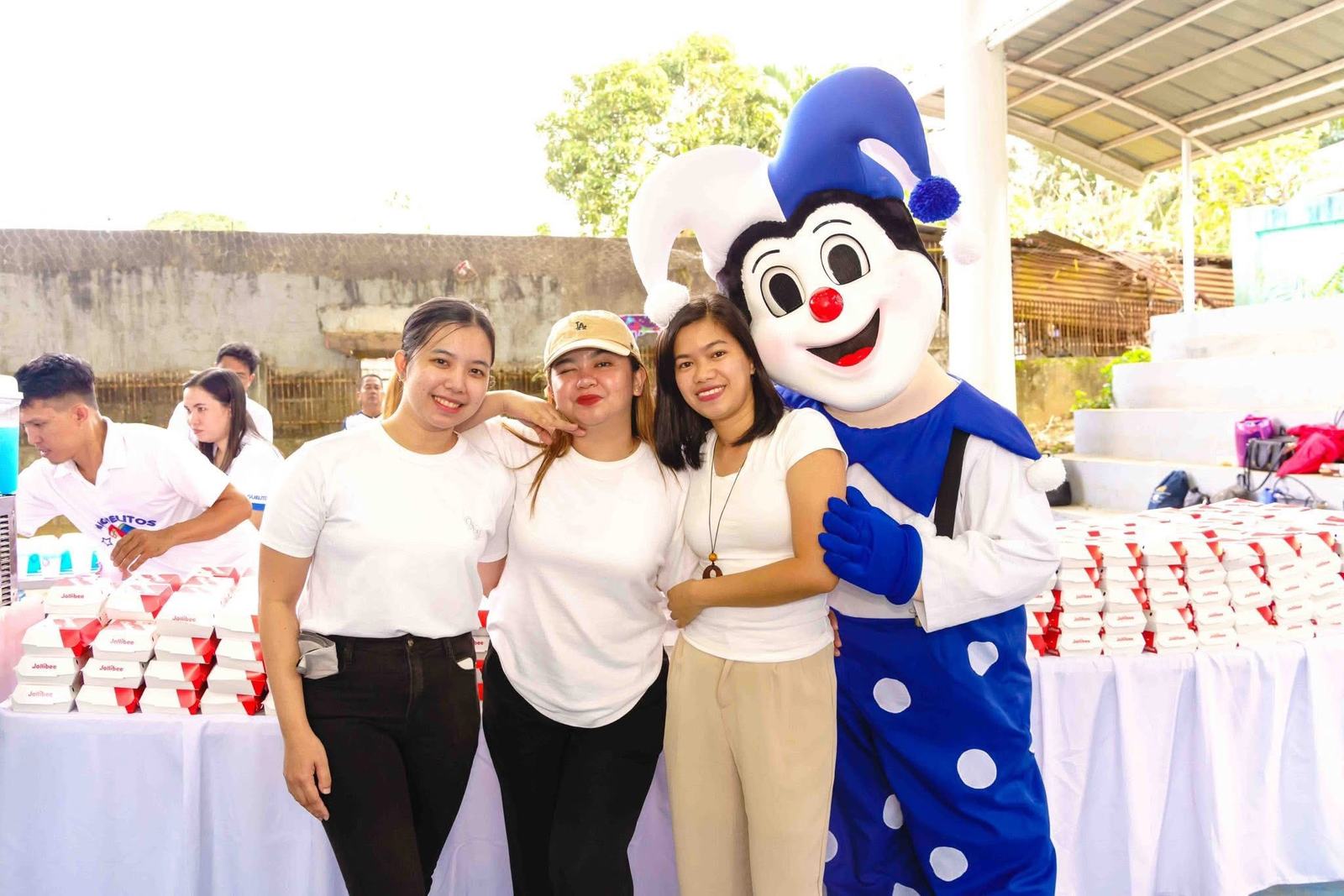 Volunteers with the Miguelitos mascot