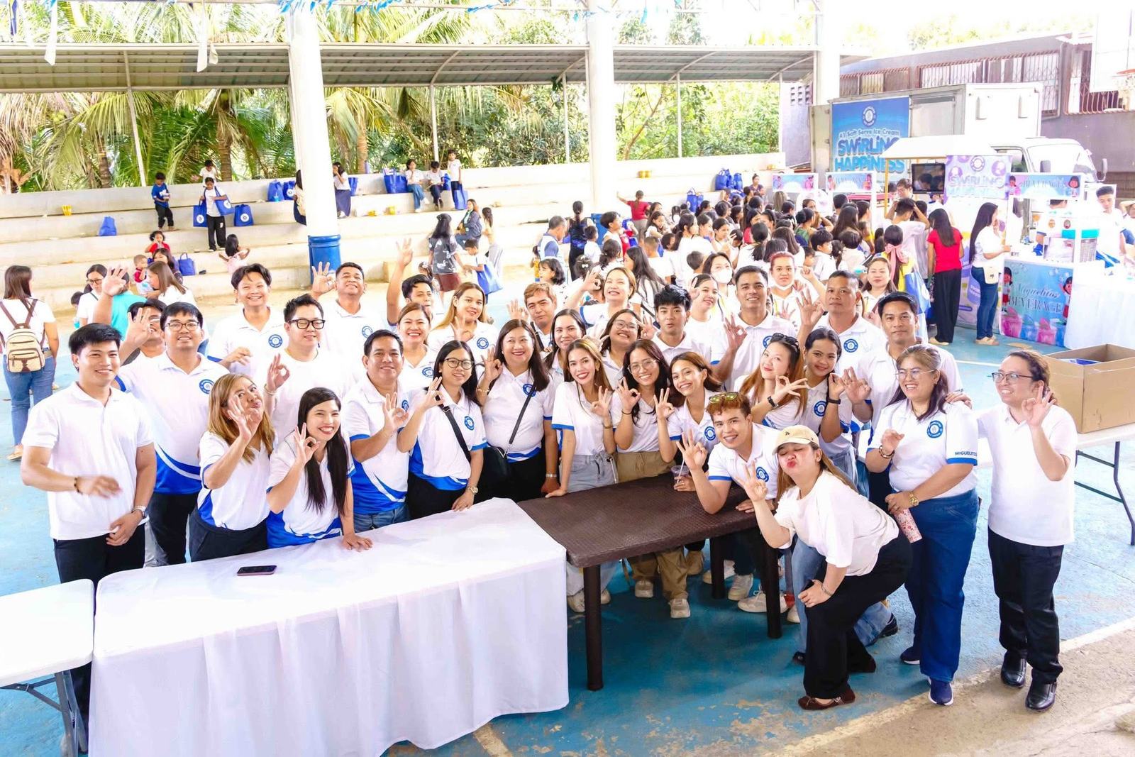 Volunteers and students gathered for a group photo