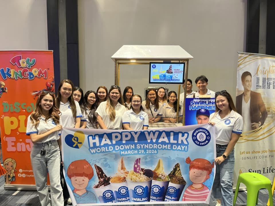 Volunteers holding a Happy Walk banner