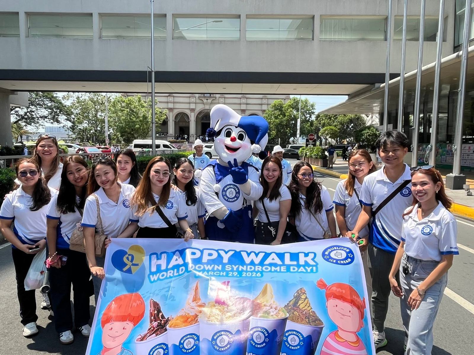 Group photo with a Happy Walk banner